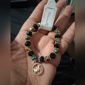 Elegant Black and Gold Beaded Bracelet with Charm